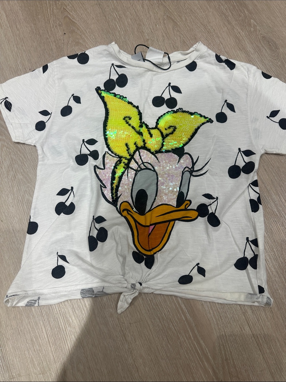 Zara White Daisy Duck Tee with Yellow Sequin Bow and Black Cherry Print